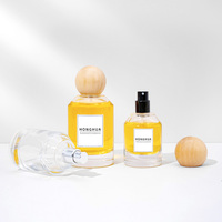 Flacon de parfum rechargeable en verre transparent 30ml 50ml 100ml avec boîte cadeau rigide ronde de luxe pour une image de marque de parfum haut de gamme