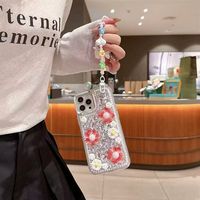 Coque de téléphone 3D à paillettes de luxe pour iPhone 17 Pro Max 16 15 14 13 12 Pro Coque en diamant bling avec sangle en forme de fleur pour filles et femmes