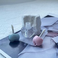 Échantillon personnalisé Nouveau produit Brillant à lèvres en forme de cœur avec breloque détachable Mini-emballage en ABS Emballage mignon pour maquillage Gloss à lèvres
