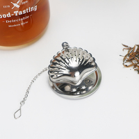 Infuseur à thé en acier inoxydable au design moderne Offre Spéciale Forme de coquille de haute qualité avec chaîne 5.2cm de diamètre Logo personnalisé Service à café et thé