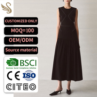 Robe midi noire sans manches personnalisée OEM ODM avec panneau à points et coupe trapèze