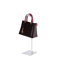 Tienda especializada en expositores de bolsos de pie, soportes ajustables para exhibición de bolsos, y expositores de bolsos de acero inoxidable para centros comerciales.