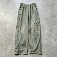 Pantalon de survêtement vintage délavé et déchiré pour homme, coupe large, taille élastique, avec bords bruts et patchwork, style streetwear