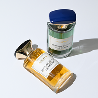 Flacon de parfum élégant et luxueux en verre plat incurvé de 50 ml avec bouchon poli bicolore