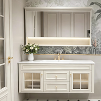 Ensemble de meubles de salle de bain de style français de luxe, armoire flottante blanche crème avec porte en verre cintrée et miroir LED intelligent, OEM ODM