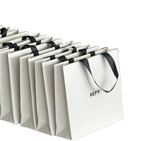 Sac cadeau pour magasin de vêtements transfrontalier, sac de shopping pour vêtements pour enfants, sac en carton blanc simple et épais, avec logo personnalisé et ruban, pour chaussures