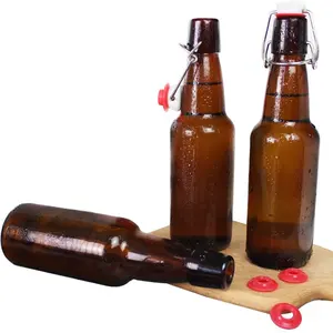 Wholesale 330ml cheap empty amber clear glass beer water bottle swing top bottle with red rubber seals