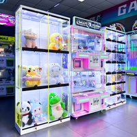 Vitrine d'exposition lumineuse à LED pour machines à griffes, présentoir multi-niveaux verrouillable en acrylique pour jouets, idéal pour les centres de jeux