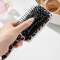 Brosse à cheveux démêlante à coussin d'air imprimé léopard, masseur de cuir chevelu, peigne de coiffure, cadeau pour femme, vente en gros, usine, Cepillo Paleta