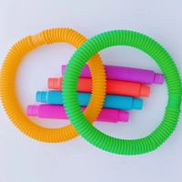 Jouet amusant et éducatif pour soulager le stress, tube pop, jouet en plastique miniature télescopique ondulé multicolore