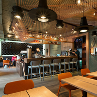 Comptoir de bar multifonctionnel de style minimaliste moderne et luxueux, avec tabourets de bar intégrés.