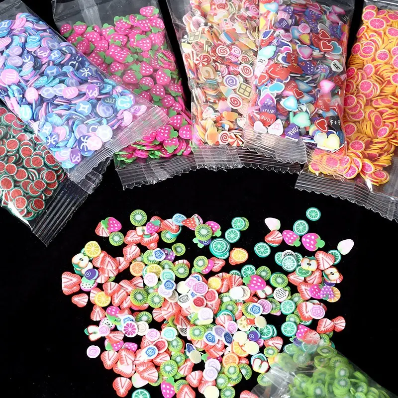 1000 قطعة من أقراص الطين الناعم لتزيين الأظافر بنفسك بملحقات الأزهار والفاكهة في حقيبة