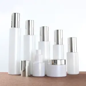 Whosale supply cosmetics pearl white glass bottle set with silver lid 20ml 30ml 60ml 100ml spray/pump lotion glass bottle set