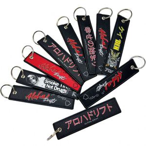 Wholesale Brand Label Woven Logo Keychain Flight Embroidered Ring <b>Custom</b> Jet Tag <b>Key</b> Chains - Product Image 1