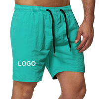Shorts de sport respirants à séchage rapide pour hommes, personnalisables OEM, couleur unie, grande taille, avec cordon de serrage, pour la gym, la course, l'entraînement et la plage