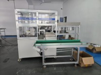 Machine automatique de bobinage continu pour le cerclage et le roulage de sacs sur valve, destinée aux emballages chimiques et d'aérosols