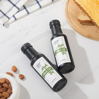 Bouteilles en verre rondes de 100ml bouteilles d'huile d'argan d'huile d'olive noire mate avec impression personnalisée bouteille d'huile de cuisson rechargeable avec verseur