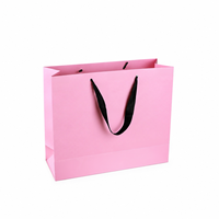 Sacs cadeaux personnalisés en papier cartonné blanc pour lancement de collections de vêtements et événements promotionnels – Emballage shopping personnalisé avec logo pour la vente au détail