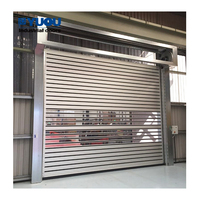 Puerta espiral automática de aluminio pesado, hermética, aislada, para talleres eficientes