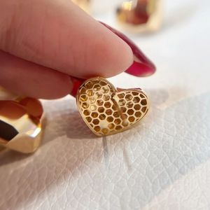 Xinfly <b>Fine</b> Jewelry Supplier Women Fashion Luxury Pure Real 18k Gold Hollow Heart Shape <b>Stud</b> <b>Earrings</b> - Product Image 4