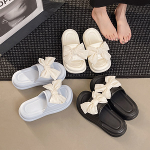 Zapatillas de suela gruesa para exteriores de verano para mujer con lazo, Sandalias planas de una palabra cruzadas a la moda, versión neta, sensación de caca - Product Image 5