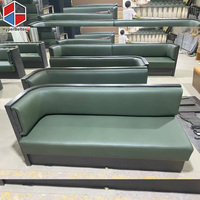 Banquette haut de gamme en bois de noyer noir avec assise en cuir vert en forme de X pour restaurant et café