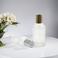 Fabricant à vendre Pompe de pulvérisation au design unique Bouteille en verre de parfum en forme de cylindre rond de 50ml