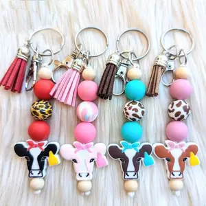 Porte-clés tête de vache porte-clés perlé en silicone pour femmes cadeaux porte-clés vache mignon avec accessoire porte-clés gland