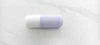 Flacon pompe en verre de 50 ml en forme de capsule, bicolore mat, vide, pour sérum cosmétique, emballage de soins de la peau, logo personnalisé