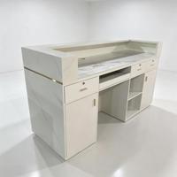 Comptoir de réception de salon de beauté de luxe haut de gamme avec éclairage LED et armoire de rangement