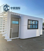 Maison conteneur jaune et noire à deux étages Zhongchen avec façade en verre, bâtiment modulaire préfabriqué pour magasin de détail