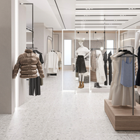 Étagères suspendues en métal personnalisées tendance pour vêtements féminins, présentoir de vêtements sur mesure avec design intérieur pour magasin de vêtements