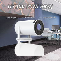 Mini Proyector de Cine en Casa HY300 con LED Integrado 480P Portátil para Teléfonos Móviles y Televisores Incluye Pantalla de Proyección