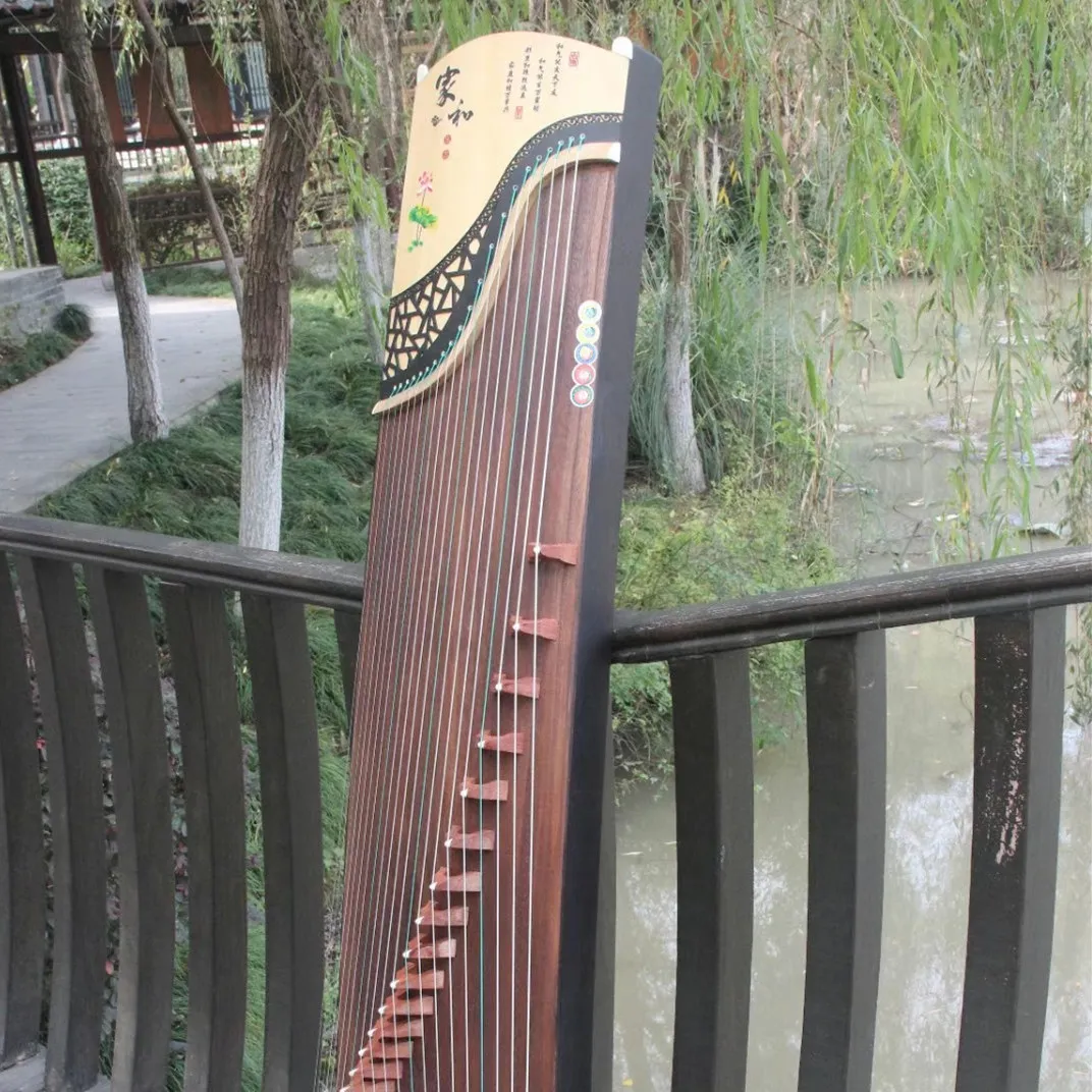 Instrumento tradicional de madera maciza de ébano Guzheng, 21 cuerdas, cremallera China