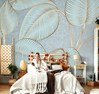 Papier peint mural en art linéaire doré avec des feuilles tropicales bleues pour salon de beauté, salon et boutique