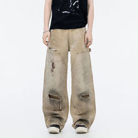 Jeans pour hommes de marques tendance avec finitions usées et salies, motifs peints à l'encre mélangée, style cabane, pantalons droits à jambes larges