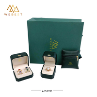Vente en gros de boîte à bijoux de luxe en PU boîte à bagues paquet vert petite pochette à fermeture éclair emballage de sac en papier