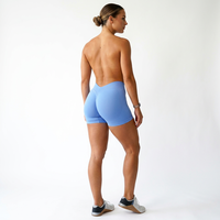 Shorts de yoga taille haute sans couture respirants bleu uni en Spandex/Nylon extensible dans quatre directions avec taille élastique en maille et design froncé aux fesses