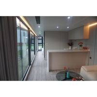 Maison conteneur moderne de 20 pieds et 40 pieds avec système de contrôle intelligent, étanche et anticorrosion, pour usage en villa et en glamping