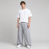 Pantalon de survêtement unisexe gris personnalisé, coupe large, style streetwear, avec taille à volants, ourlet brut et broderie