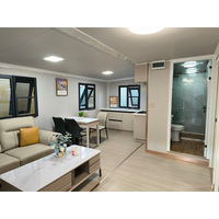 Maison conteneur portable moderne à double aile extensible avec revêtement en bois, préfabriquée, avec cuisine, salle de bain et salon