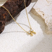 Collier élégant et délicat avec nœud papillon doré, zircon brillant de haute qualité, accessoires de bijoux de mode pour femmes, vente en gros TGXL14679
