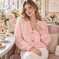 Cardigan rose personnalisé pour femme avec nœud, col en V, boutonné, manches longues, tricot 3D avec nœud, OEM ODM, faible MOQ