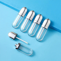 Tube de brillant à lèvres personnalisé OEM, contenant cosmétique vide en forme de pilule avec capuchon chromé et applicateur Doe-Foot