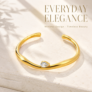 Brazalete abierto irregular chapado en oro amarillo claro, resistente al deslustre, con diseño de pera y engaste de garra retorcido, para mujer, boda, estilo moderno - Product Image 1