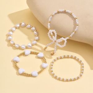 European and American cross-border elegant and versatile heart-shaped faux pearl <b>bracelet</b> four-piece <b>set</b> with bow stacking - Product Image 3
