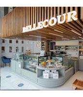 Ensemble de bar en forme de L en surface solide Corian avec design de façade perlée et éclairée, idéal pour les bars extérieurs, les bars domestiques et les sous-sols