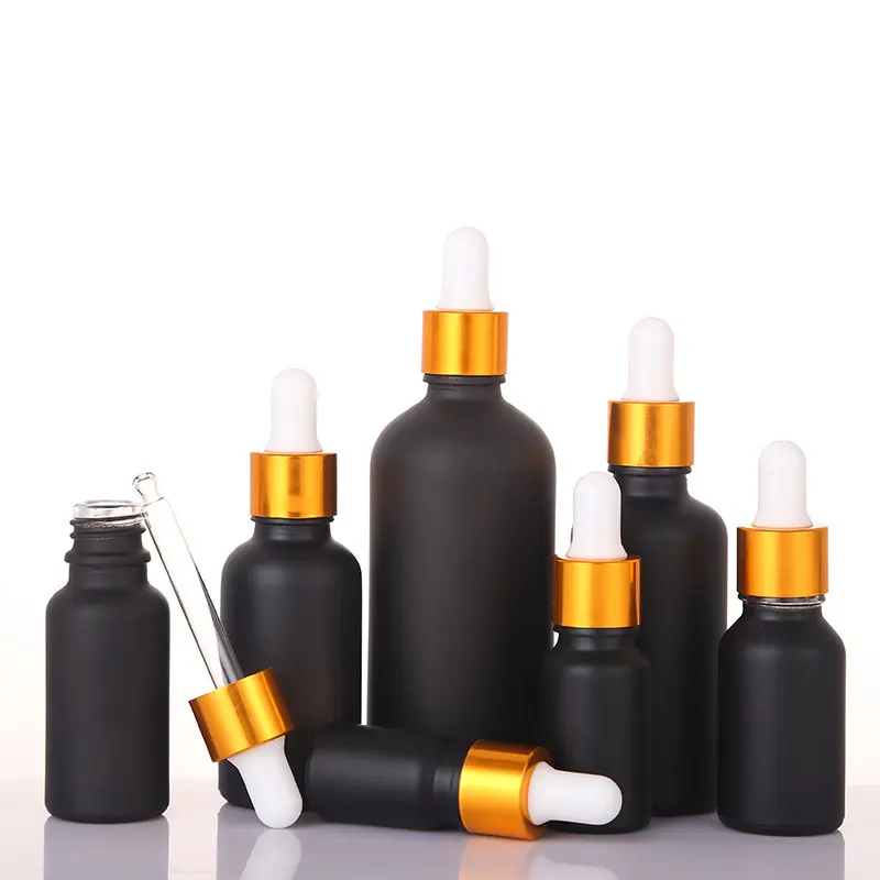 Venta al por mayor 30ml 50ml 100mL Scrub botella de aceite negro 30ml 15ml botella cuentagotas de vidrio Envase cosmético botella de spray negro
