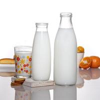 Vente en gros de haute qualité 200ml 250ml 500ml 1000ml emballage de boisson de jus de yaourt vide bouteille de lait en verre avec couvercle en métal