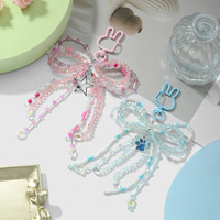 Nouveau luxe inspiré lumière luxe frais haute beauté Imitation cristal perle arc étoile Fine mousseux chat griffe bricolage porte-clés métal